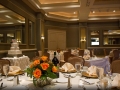 Tables set with Orange Flower Centerpieces