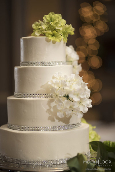 White cake with Floral Accent and Silver Band